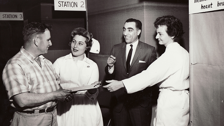 A longshore worker signing up for a "multiphasic" exam, which provided a comprehensive health assessment, in 1963.