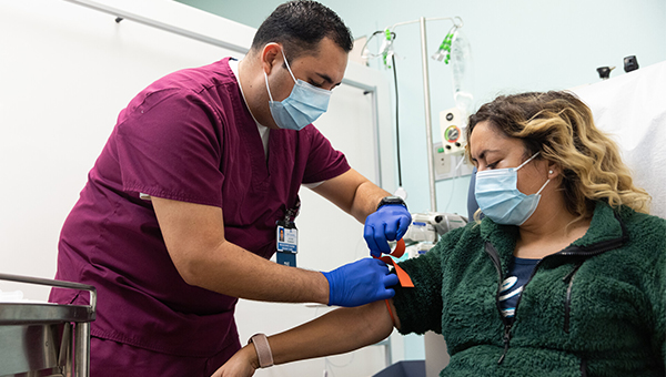 Man attending female patient