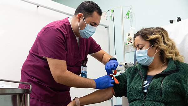 medical assistant prepping a patient