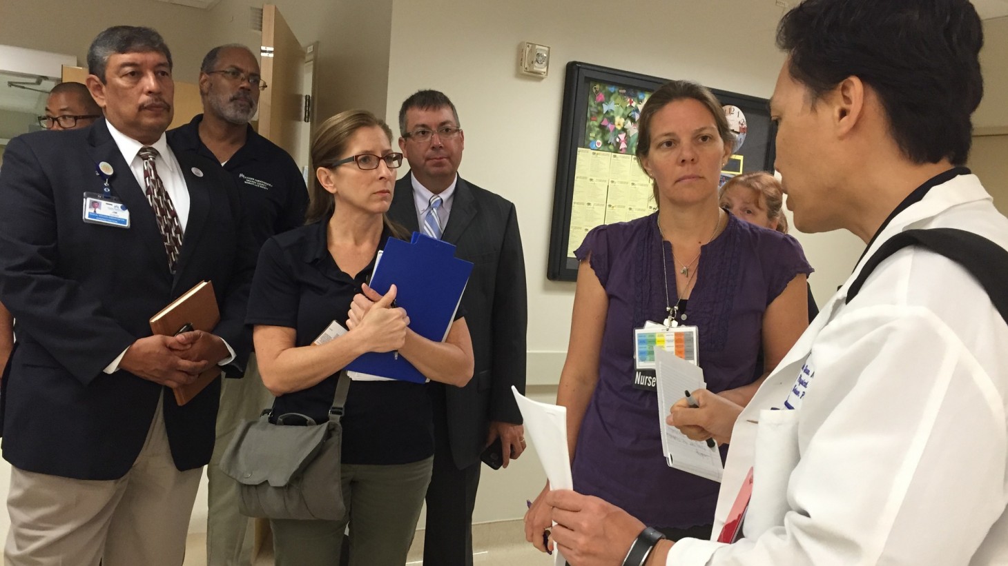 Tiger Team members debrief with an assistant department administrator